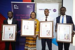 Kibet Brian and Jerameel Kevins Owuor receive the award from Hon. Chief Justice Martha Koome.